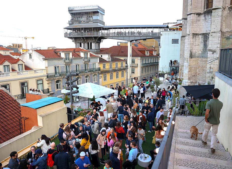 Attendees partying at a rooftop bar in Lisbon’s downtown